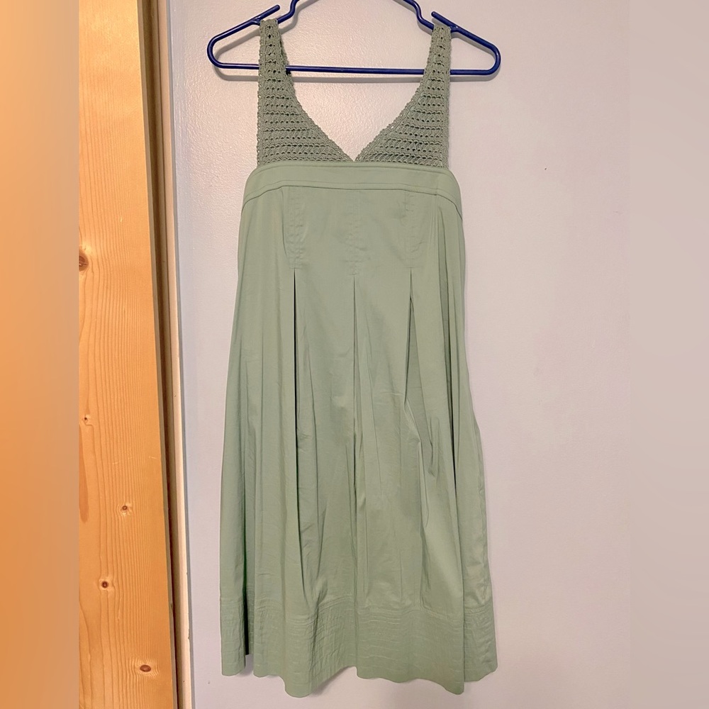 Adorable great/teal event dress with pockets and bow back detail